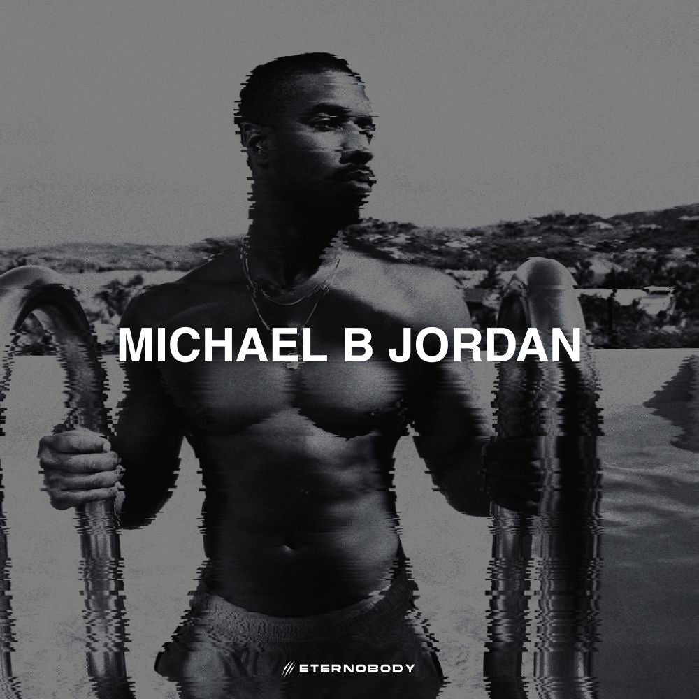 Black and white image of a shirtless Michael B. Jordan emerging from water, with a pixelated effect on the water. "MICHAEL B JORDAN" text overlays the image.